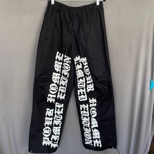 ☑️NWT BoohooMAN SUPER WIDE elastic waist pants with white writing on front. SZ30